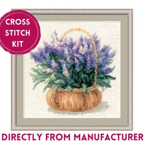 May include: Cross stitch kit featuring a bouquet of lavender flowers in a brown wicker basket. The flowers are purple and white, and the basket is surrounded by green leaves.