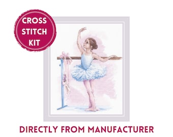 May include: A cross stitch kit featuring a printed illustration of a ballet dancer in a white tutu standing at a wooden barre. The dancer has one arm raised and is positioned next to a blue barre stand with pink ballet slippers hanging from it.