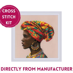 May include: Cross stitch kit featuring a woman with dark skin wearing a colorful head wrap and jewelry. The woman is looking to the side and has a neutral expression. The background is a light pink.