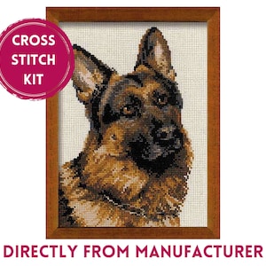 May include: Cross stitch kit featuring a brown and black German Shepherd dog with a white background. The kit is framed in a brown wooden frame.