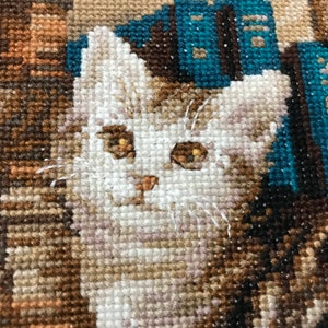The RIOLIS cross stitch kit Furry Friends features beautiful three kittens playing. The kit includes wool acrylic threads in 20 colors, a needle, Zweigart 14ct flaxen AIDA fabric and a color chart. The finished size is 40x30 cm
