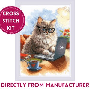 May include: Cross stitch kit depicting a grey cat wearing spectacles and using a laptop computer. The cat is seated at a table with a cup of coffee and books.