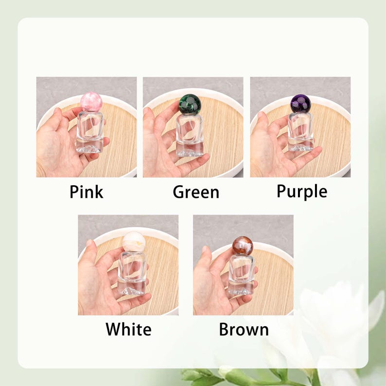 May include: Five small, clear glass bottles with colored spherical stoppers. The stoppers are pink, green, purple, white, and brown. Each bottle is labeled with its corresponding color name: Pink, Green, Purple, White, and Brown.