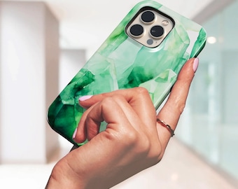 May include: A smartphone case featuring a vibrant emerald green and white abstract crystal or gemstone pattern. The case has a glossy finish and includes precise cutouts for the triple camera lens array and flash on the back of the device.