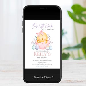 May include: A smartphone displays a digital invitation for a first birthday. The invitation features a watercolor illustration of a yellow chick hatching from a pink egg, surrounded by pastel Easter eggs and foliage. Text reads "This Little Chick is Turning One!" and details for the party.