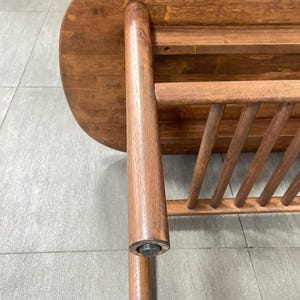 detailed of a solid wood coffee table in walnut finish.