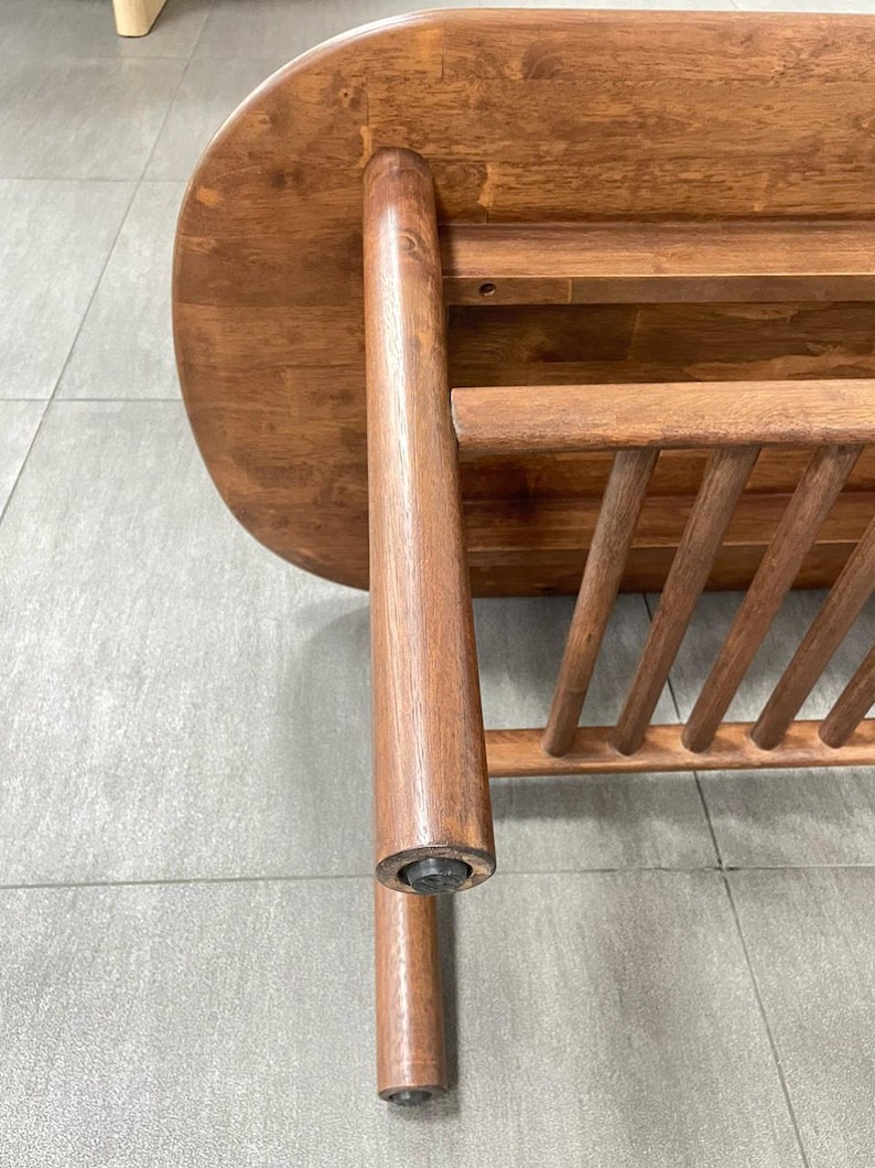 detailed of a solid wood coffee table in walnut finish.
