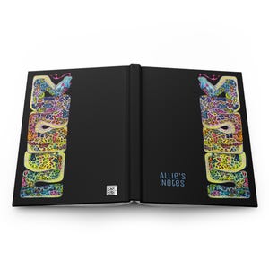May include: A black notebook with a colourful snake design on the cover. The text "Allie's Notes" is printed on the front cover.