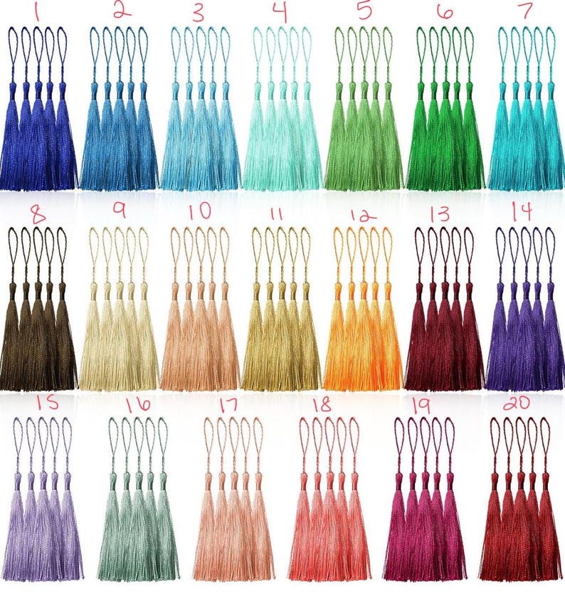 May include: Twenty different colours of tassel trim, each colour shown in a set of five tassels. The tassels are made of a soft, silky material and have a loop at the top for easy attachment.