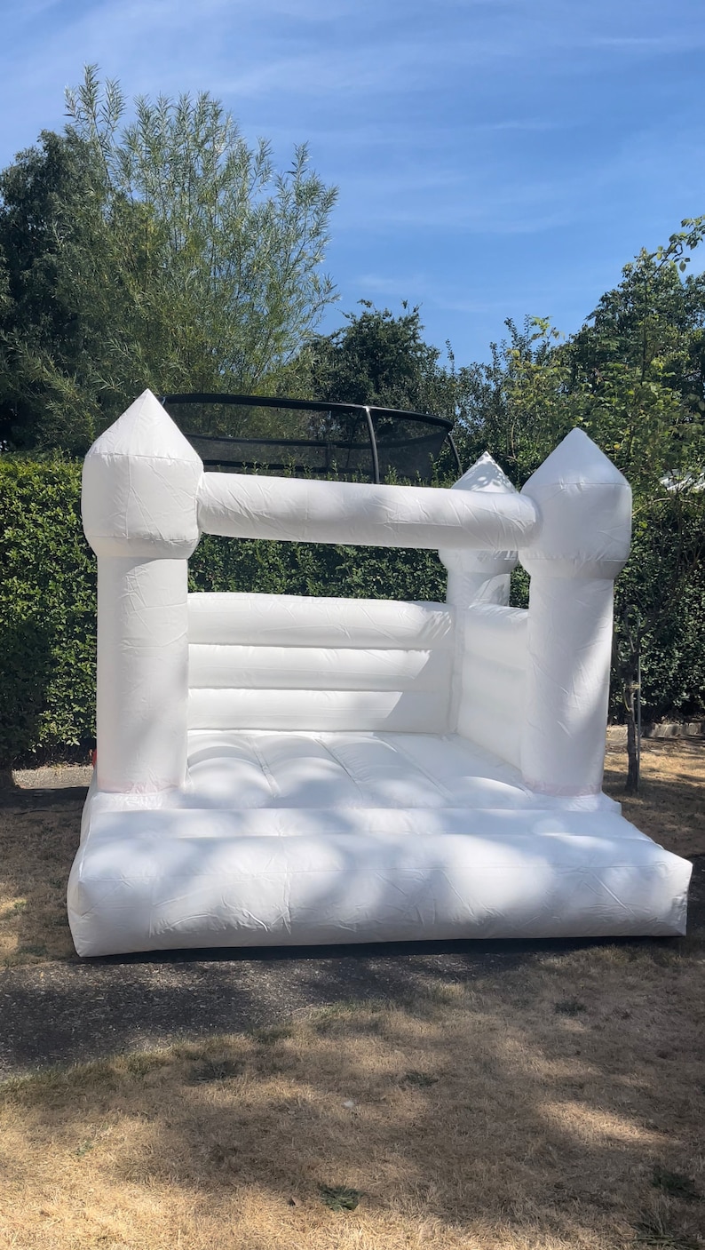 Inflatable White Bouncy Castle and Ball Pit Hire for Kids Parties