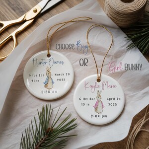 Ceramic baby boy ornament featuring blue bunny illustration