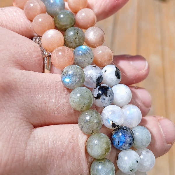 Sunstone AAA, Dark Grey Labradorite AAA, & Moonstone with Tourmaline.  8mm beads, size 7 bracelet. With Drawstring bag/crystal meaning card