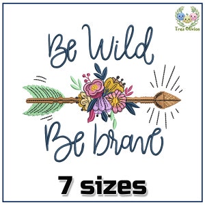 May include: Embroidered design featuring a floral arrow with the text "Be Wild Be Brave" in blue cursive lettering. The design is available in 7 sizes.
