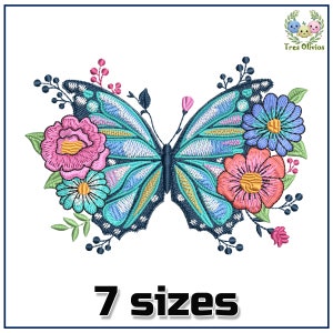 May include: Embroidered design of a blue butterfly with pink, orange, and blue flowers. The design is surrounded by green leaves and berries. The text "7 sizes" is below the design.