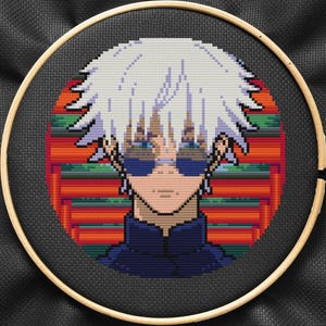 May include: Cross-stitch embroidery of an anime character with white hair, wearing sunglasses and a dark blue shirt, against a red and green background.