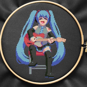 May include: Cross-stitch embroidery of an anime character with blue hair playing a guitar. The character is wearing a black and red outfit and is sitting on a stool.