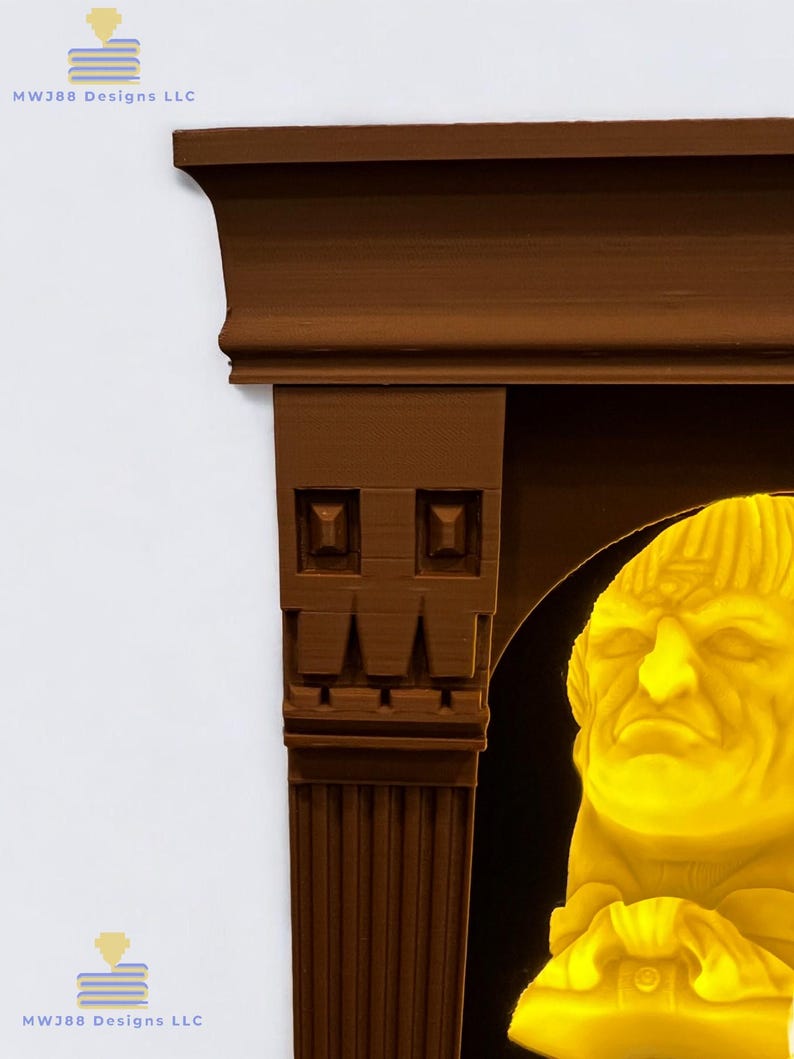 May include: A brown wooden frame with a decorative design surrounds a yellow illuminated bust of a man with a serious expression. The frame has a fluted column on the left side and a decorative arch on the right side.