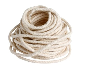 May include: A coiled bundle of off-white rope, tightly wound and textured. The rope appears to be made of a natural fiber, with a consistent thickness throughout. The image is set against a plain white background.