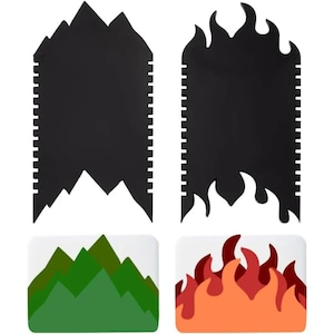 May include: A set of four black and white textured cake decorating tools. Two are black with mountain and flame shapes, and two are white with green mountain and red flame designs.