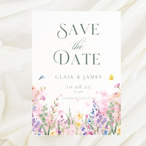 Può includere: Un biglietto floreale "Save the Date" con i nomi "Clair & James" e la data "10.08.25". Il biglietto presenta un design ad acquerello di fiori rosa, viola e gialli nella parte inferiore, con una libellula e una farfalla.