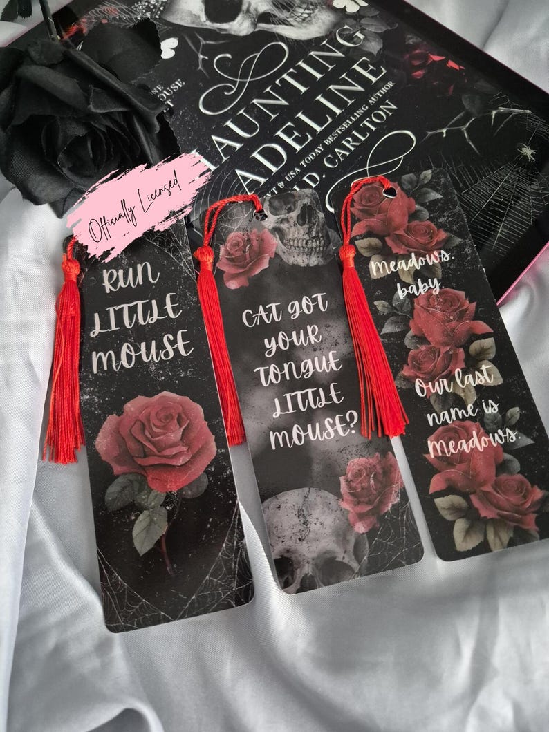 May include: Three black bookmarks with red tassels, featuring roses, skulls, and text. The bookmarks read "Run Little Mouse", "Cat Got Your Tongue Little Mouse?", and "Meadows Baby, Our Last Name is Meadows."