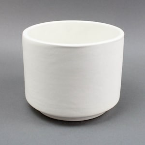 May include: A white ceramic planter with a rounded base and a smooth, matte finish.