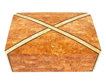 May include: A rectangular box made of orange and beige marble with a cross pattern inlaid in the top.
