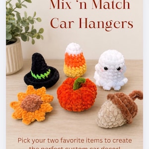 May include: Six small crocheted items including a black witch hat with a green band, a candy corn, a white ghost, a yellow sunflower, an orange pumpkin, and a brown acorn. The text reads Mix 'n Match Car Hangers and Pick your two favorite items to create the perfect custom car decor!