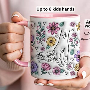 Personalized floral kids hands mug with custom names and grandma title, hand-holding illustration and flowers.