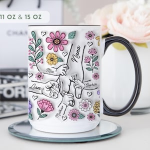 Personalized floral kids hands mug with custom names and grandma title, hand-holding illustration and flowers.