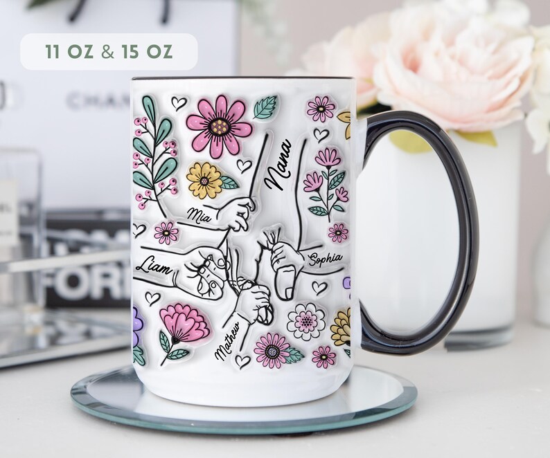 Personalized floral kids hands mug with custom names and grandma title, hand-holding illustration and flowers.