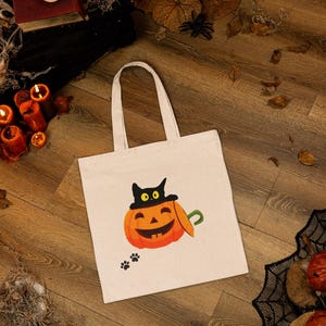 Halloween White Cotton Tote Bag: Eco-Friendly Design with Cat and Pumpkin