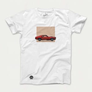 May include: White t-shirt with a red Ford Mustang car graphic on the front. The car is in a square box on the shirt.