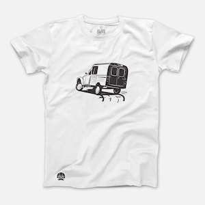 May include: White t-shirt with a black and white illustration of a vintage van. The text "Get Out & Drive" is printed on the shirt.
