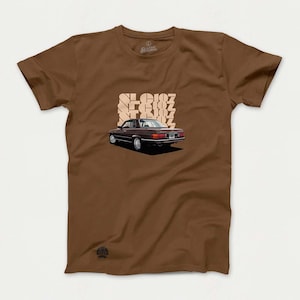 May include: A brown t-shirt with a vintage car illustration and the text "SL 607" printed on the front.