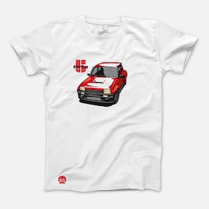 May include: White t-shirt featuring a red and black illustration of a vintage sports car with the word "turbo" in red. The shirt has a crew neck and short sleeves. The Classic Original logo is visible on the upper left.