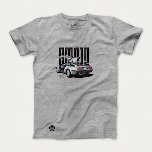 May include: A gray t-shirt with a black and white illustration of a DeLorean time machine with the text "Great Scott" underneath. The text "1.21 GIGAWATTS" is printed in black on the shirt.