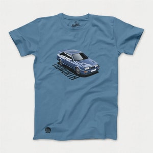 May include: A blue Ford Sierra Cosworth RS500 graphic on a light blue t-shirt. The car is a classic sports car with a white roof and black wheels.