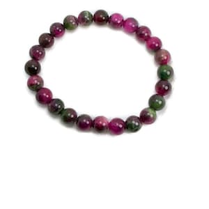 May include: A bracelet made of green and pink gemstone beads. The beads are round and have a smooth, polished finish.