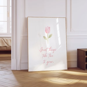 May include: A white framed poster with a pink watercolor tulip and the text "Great things take time to grow."