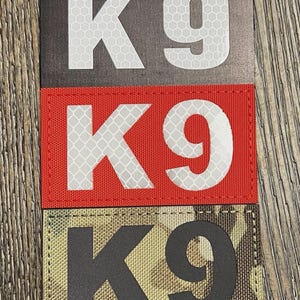 May include: A set of three ceramic mugs with a speckled, matte finish in cream, light grey, and dark grey. Each mug has a simple, minimalist design and a rounded handle.