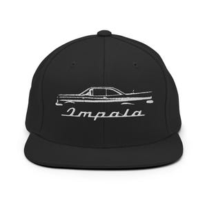May include: Black baseball cap with a white embroidered outline of a classic car and the word "Impala" in cursive. The cap has a flat peak and a structured fit, suitable for casual wear.