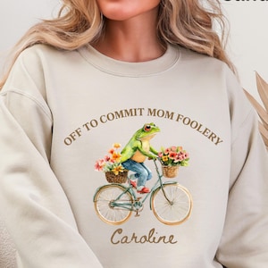 May include: A set of three ceramic mugs with a speckled, matte finish. The mugs are in shades of cream, light gray, and dark gray. Each mug has a simple, minimalist design, perfect for coffee or tea.