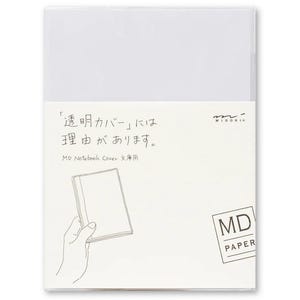 May include: A white notebook cover with the text "'Transparent Cover' has a reason." and "MD Notebook Cover" in Japanese. The cover is illustrated with a hand holding a notebook.