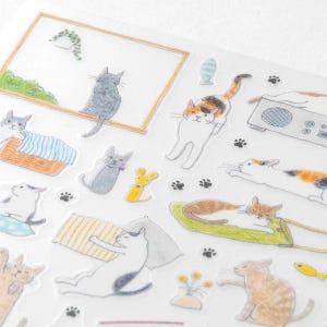 May include: A sheet of clear stickers featuring various illustrations of cats in different poses. The stickers are ideal for adding a touch of whimsy to journals, planners, and other paper crafts.