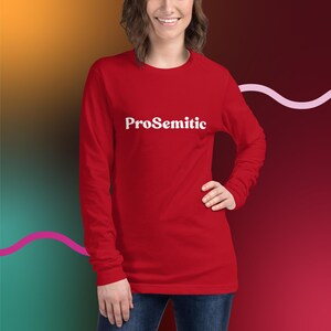May include: Red long-sleeve shirt with the text "ProSemitic" in white letters on the front.