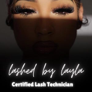 May include: A close-up of a person's eyes with long eyelashes. The text "lashed by layla" and "Certified Lash Technician" is below the eyes. A QR code with the word "INSTAGRAM" below it is at the bottom of the image.
