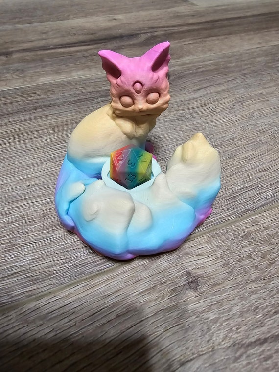 3D Printed Arcadia the All-Seeing Cat Dice Holder and display in Pastel Rainbow Gradient