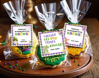 May include: Three clear plastic bags with purple and green Mardi Gras themed cookies and tags. The tags have the text "Thank you for being part of my Krewe!" and "Laissez les bon temps rouler!" with the names Mackenzie and Dylan.