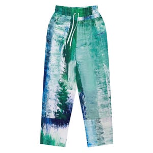 May include: Abstract art-inspired sweatpants in shades of blue, green, and white. The pants feature a drawstring waist and a loose fit. The design resembles brushstrokes, creating a unique and artistic look. The overall aesthetic is modern and casual.